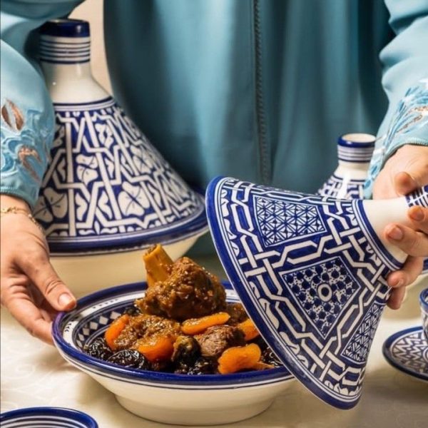 Moroccan ceramic tagine pot with a distinct domed lid and intricate hand-painted designs